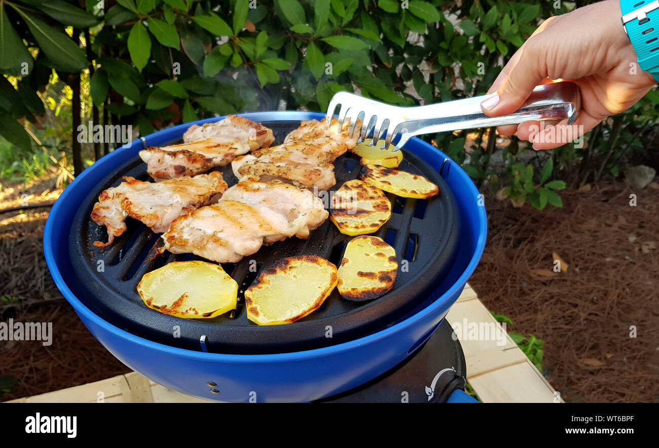 Easy campsite meals grill meat with outdoor camping grill portable