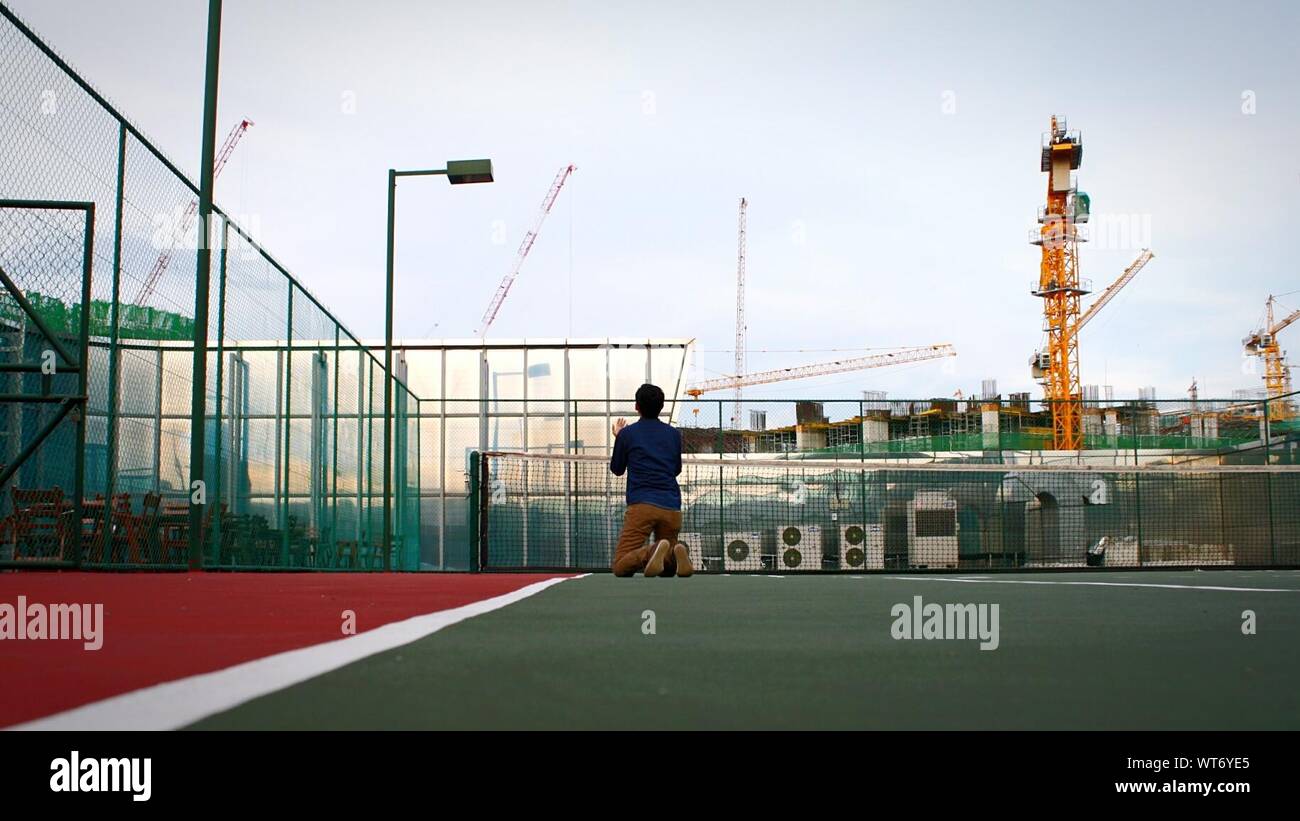 Man Kneeling, Rear High Resolution Stock Photography and Images - Alamy