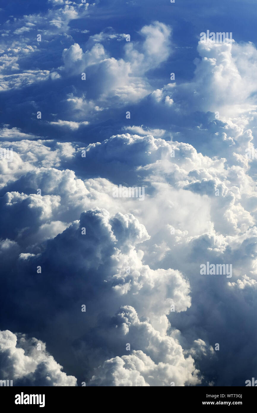 Low Angle View Of Fluffy Clouds In Sky Stock Photo
