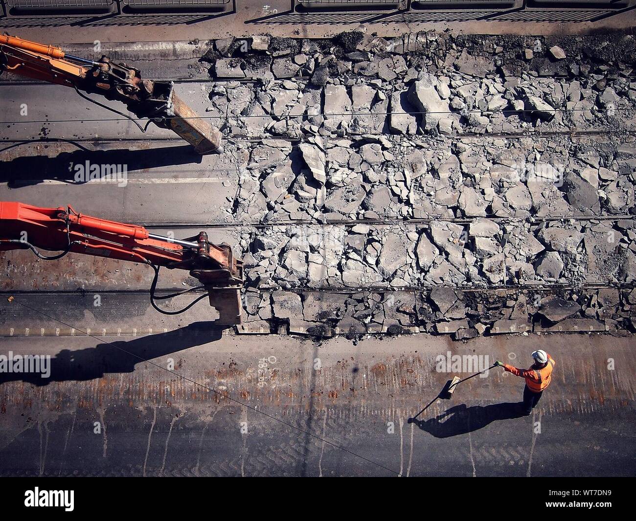 Heavy Machinery Crashing Concrete Surface Stock Photo
