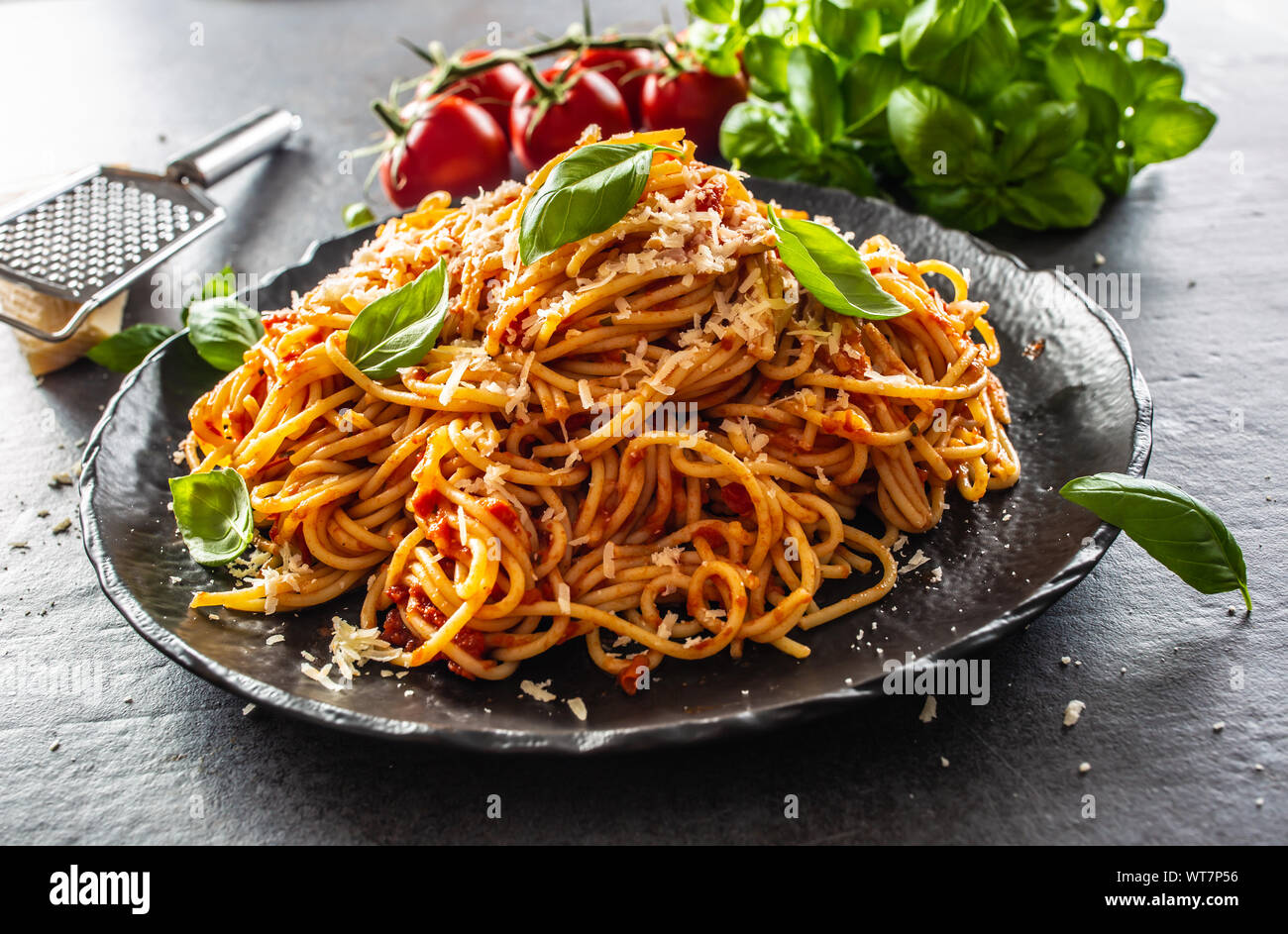 Pasta spaghetti toamto and bolognese sauce with oilve oil parmesan and basil Stock Photo