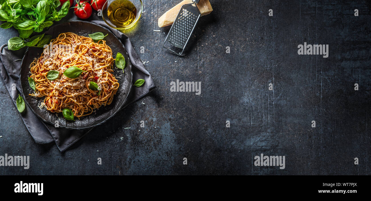 Pasta spaghetti toamto and bolognese sauce with oilve oil parmesan and basil Stock Photo