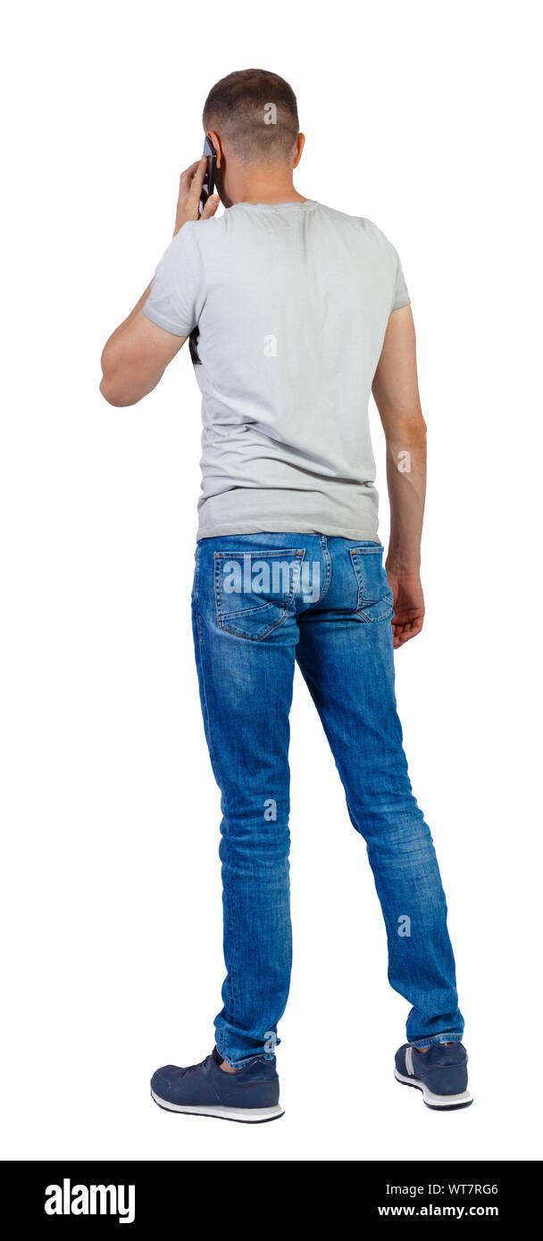 back view of a man talking on the phone. backside view of person. Rear ...