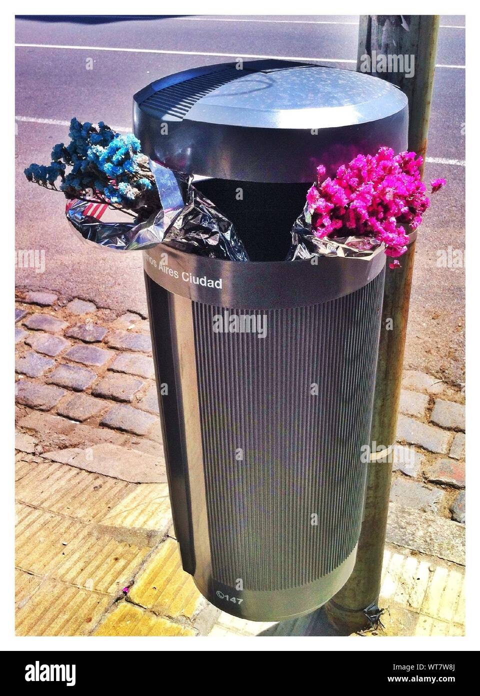Flowers in garbage can trash Cut Out Stock Images & Pictures Alamy