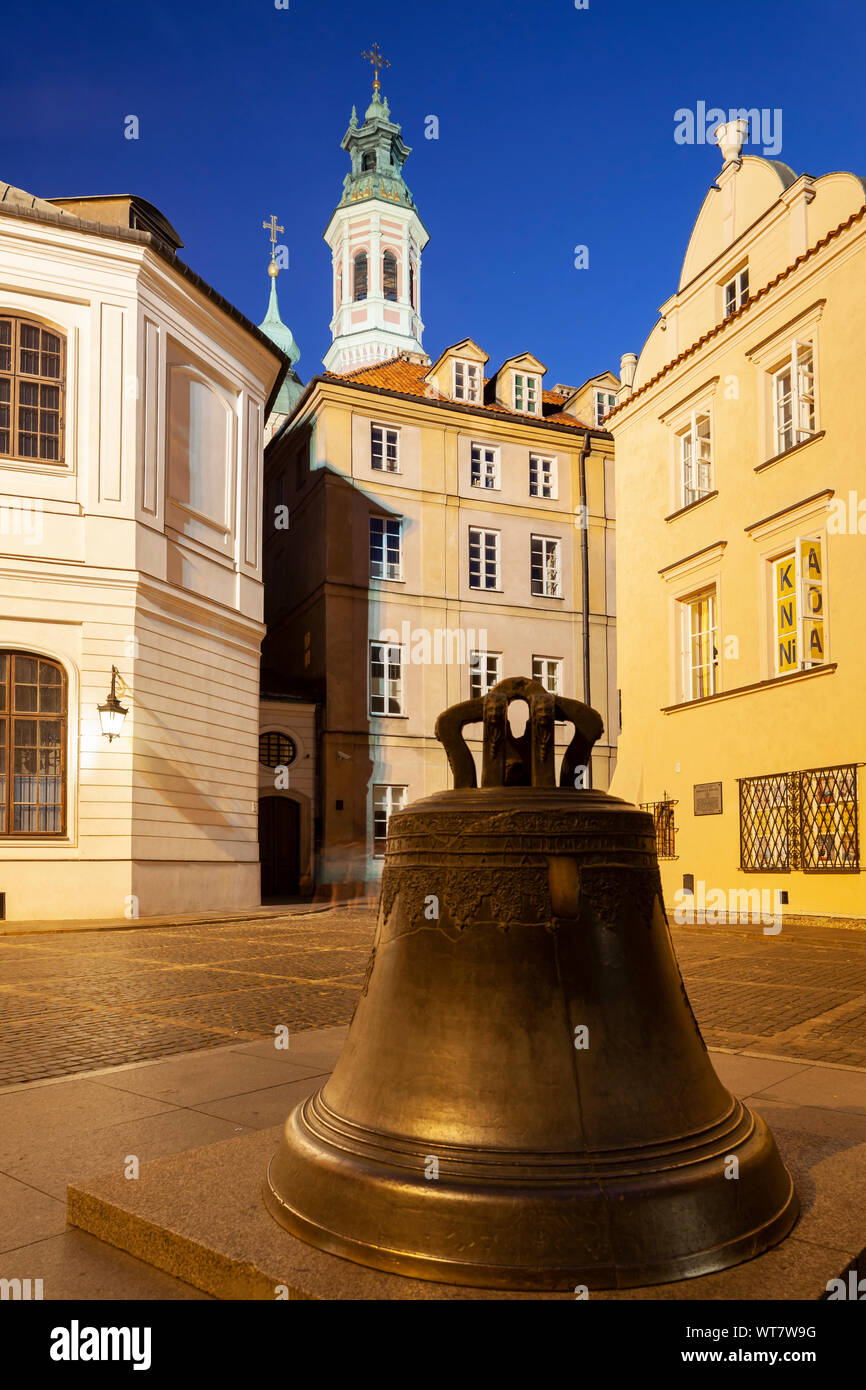 Evening at the Wishing Bell in Warsaw old town, Poland. Stock Photo
