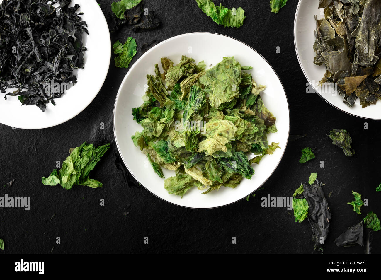 Dry seaweed, sea vegetables, close-up overhead shot on a black background Stock Photo