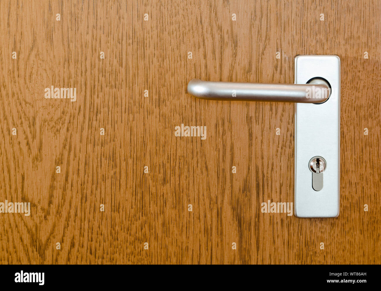 Door handle - Section of a modern internal door with handle and lock Stock Photo