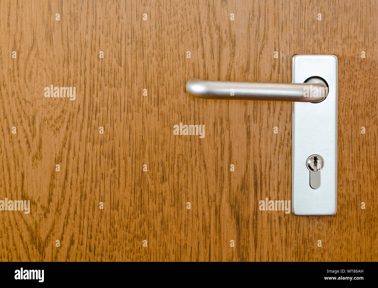Section of a modern internal door with handle and lock Stock Photo