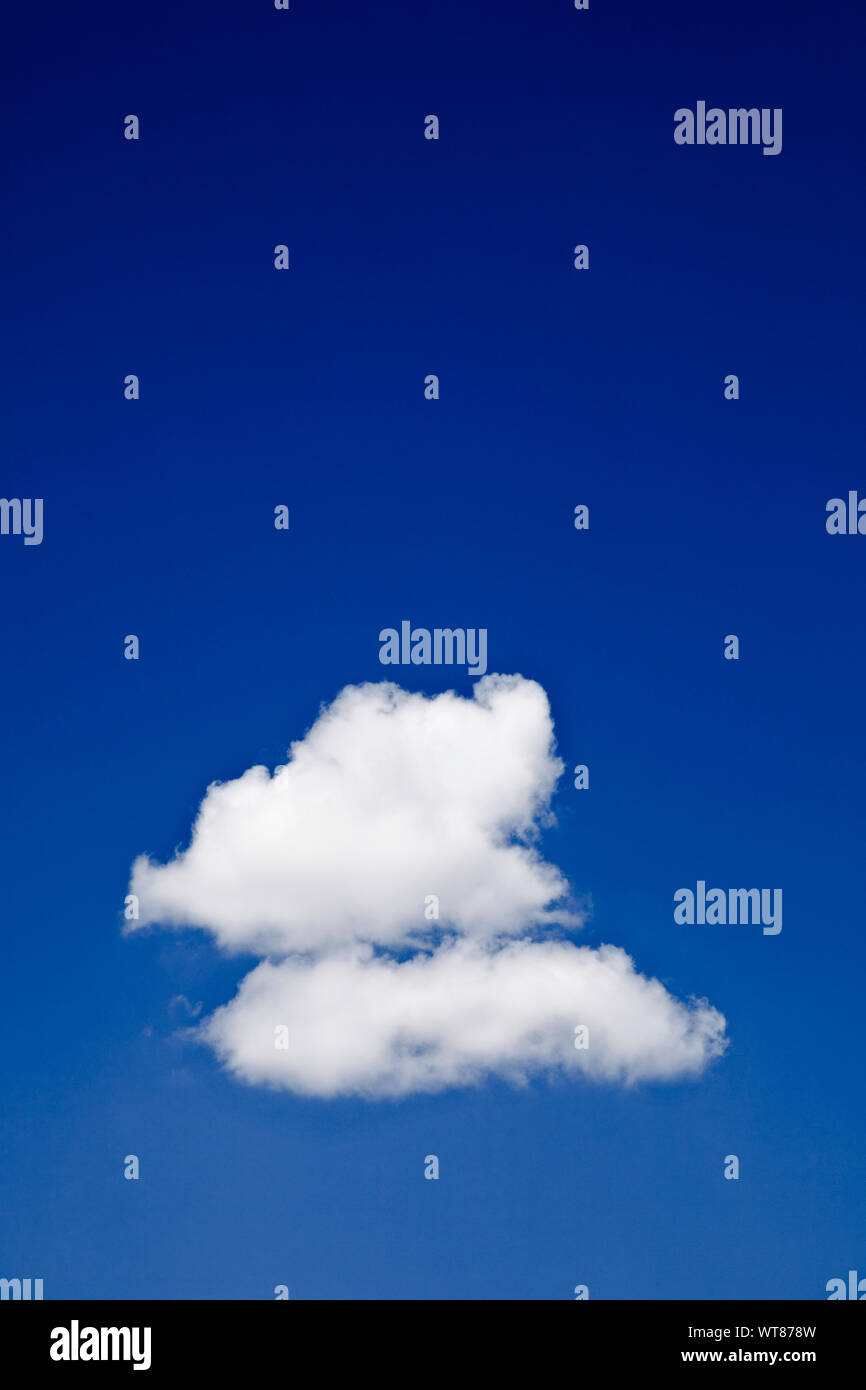 Rich Blue sky and solitary clouds Stock Photo
