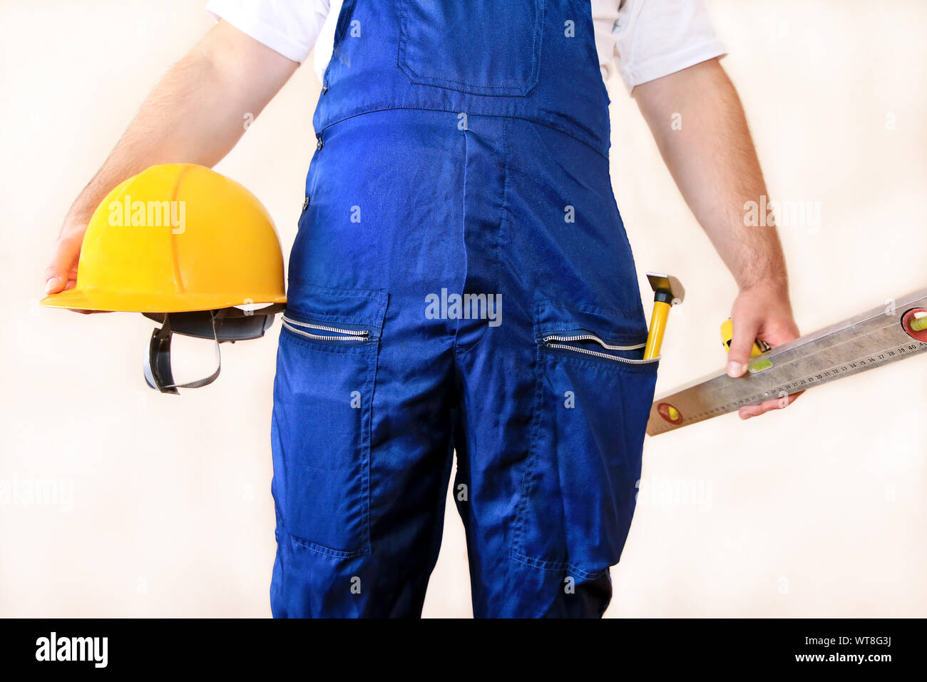 Construction worker at construction site with protective uniform