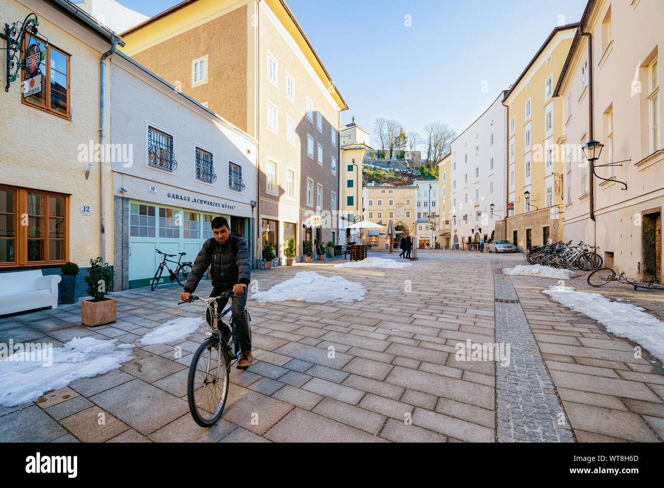 Man on bicycle at Priesterhausgasse Street in Salzburg of Austria Stock Photo