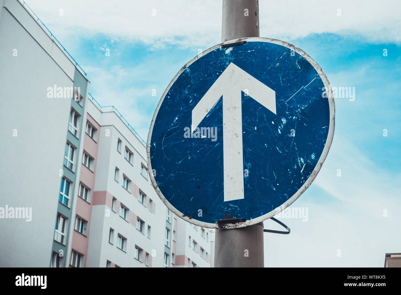 blue traffic sign with white arrow Stock Photo Alamy