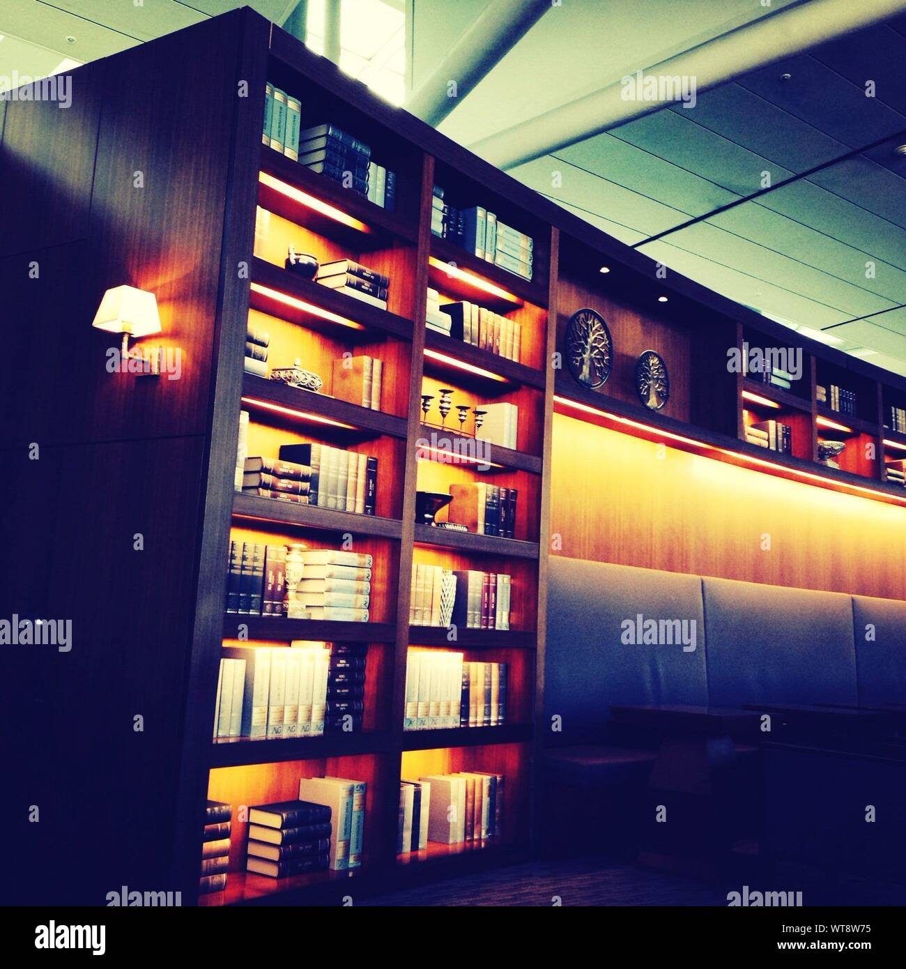 View Of Illuminated Bookshelf Stock Photo