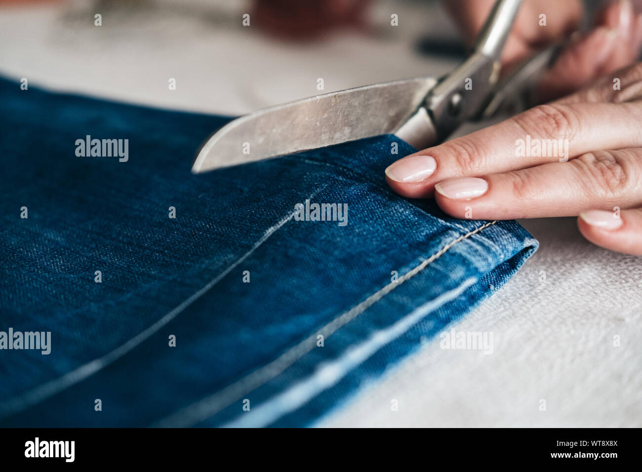 Tailor cutting cloth hires stock photography and images Alamy