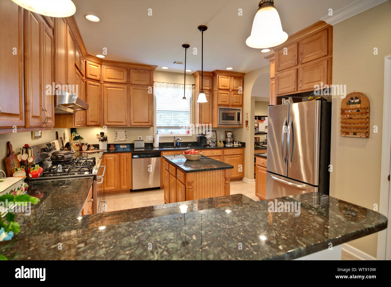 Maple cabinets with 2024 black granite countertops