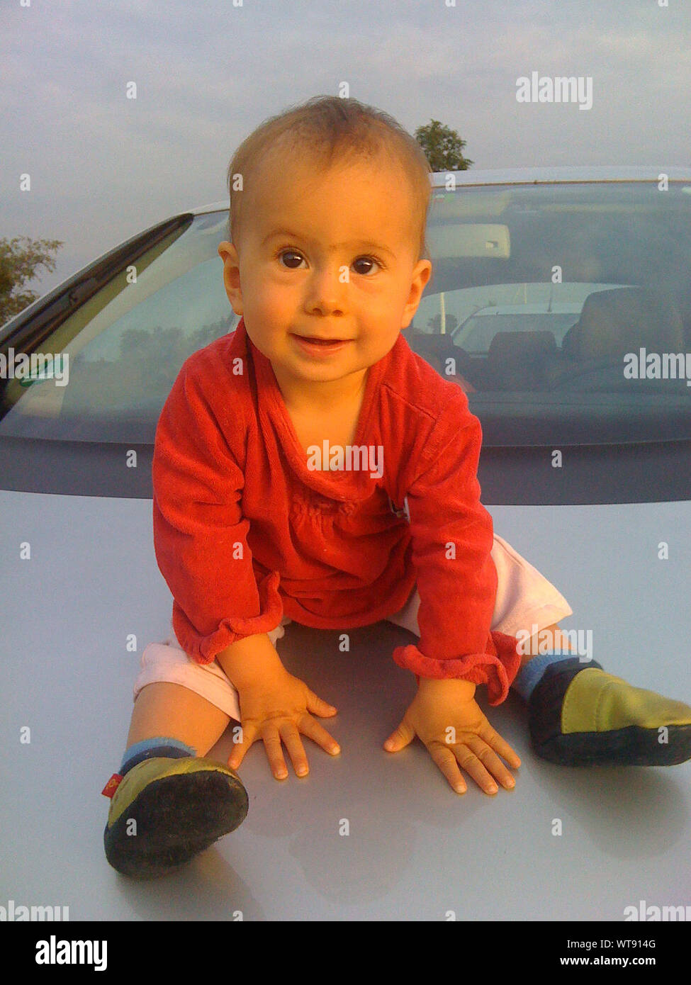 Girl on hood of car hires stock photography and images Alamy