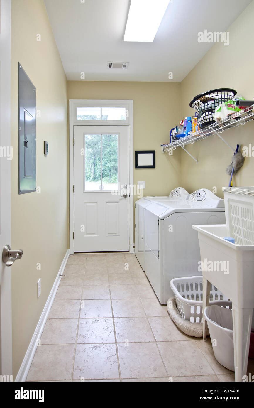 residential laundry room with white appliances Stock Photo Alamy