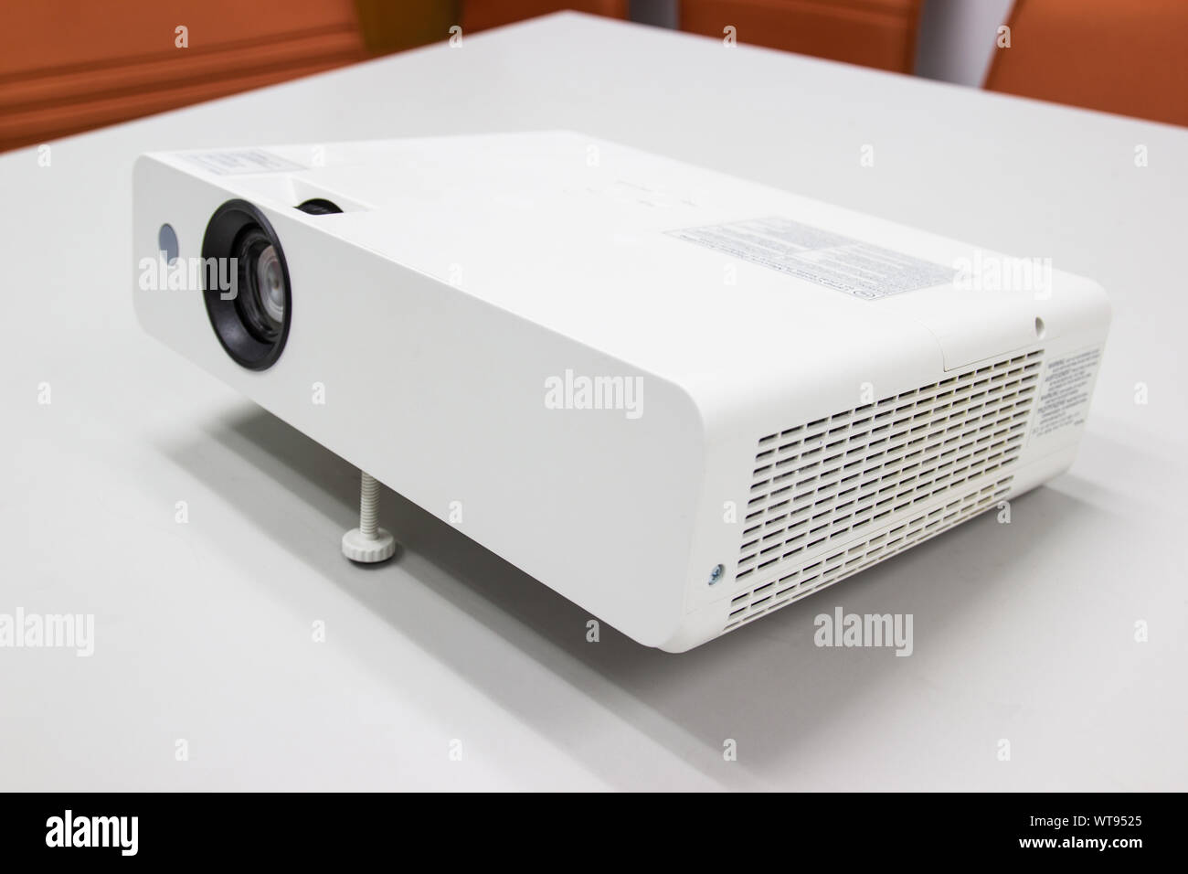 white projector for presentation for business work on table in a meeting room Stock Photo