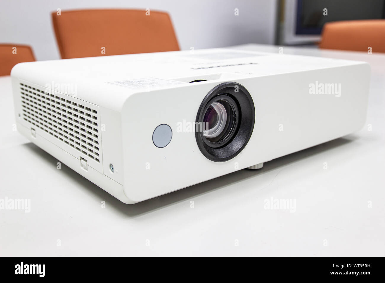 white projector for presentation for business work on table in a meeting room Stock Photo