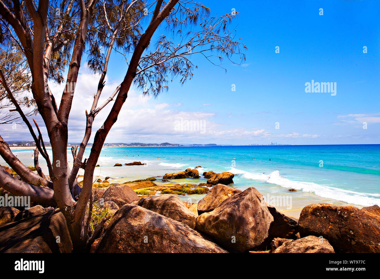 Scenic View Of Kirra Beach Against Blue Sky Stock Photo