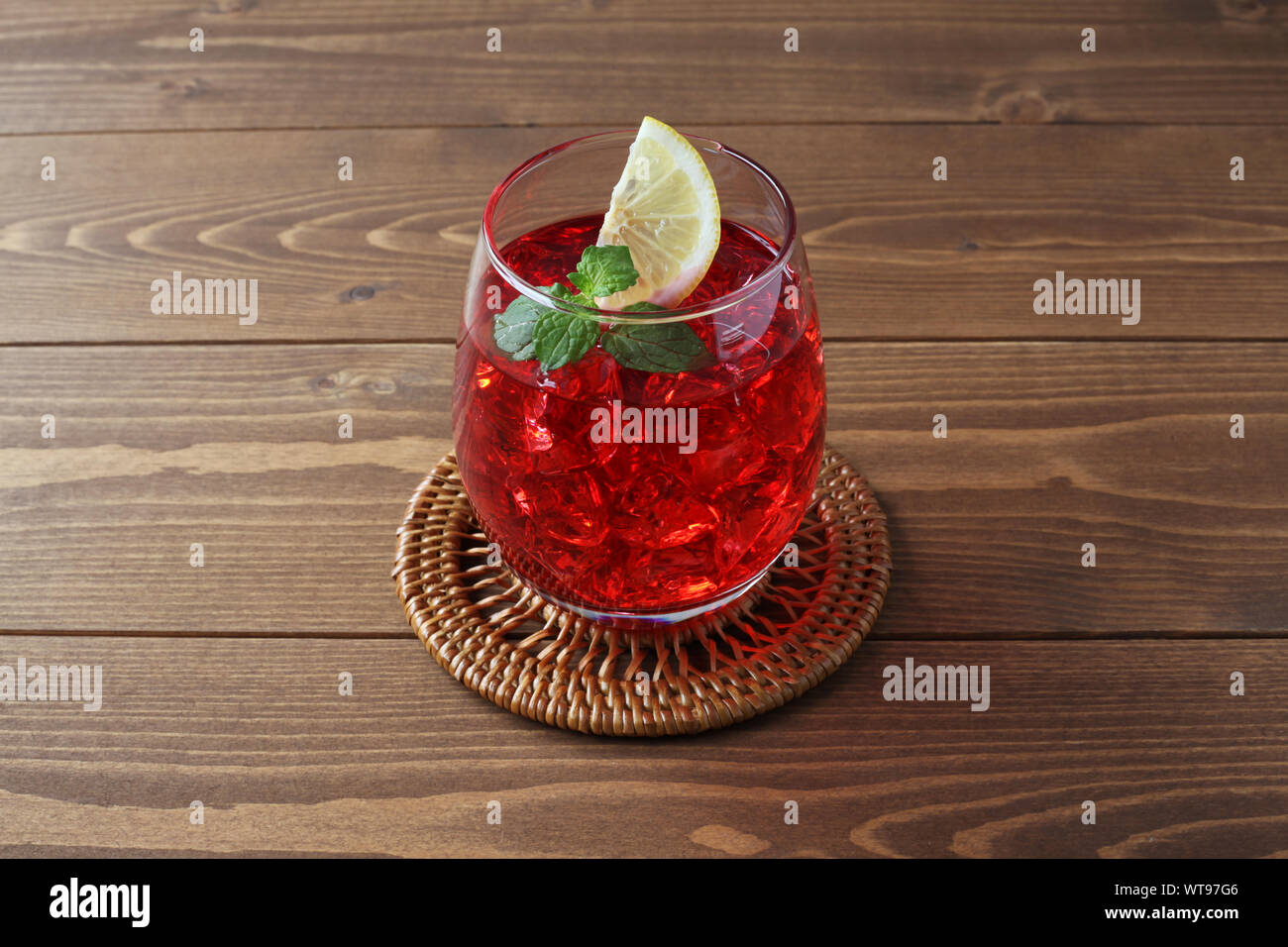 glass of cold tea red drink closeup isolated on table Stock Photo - Alamy