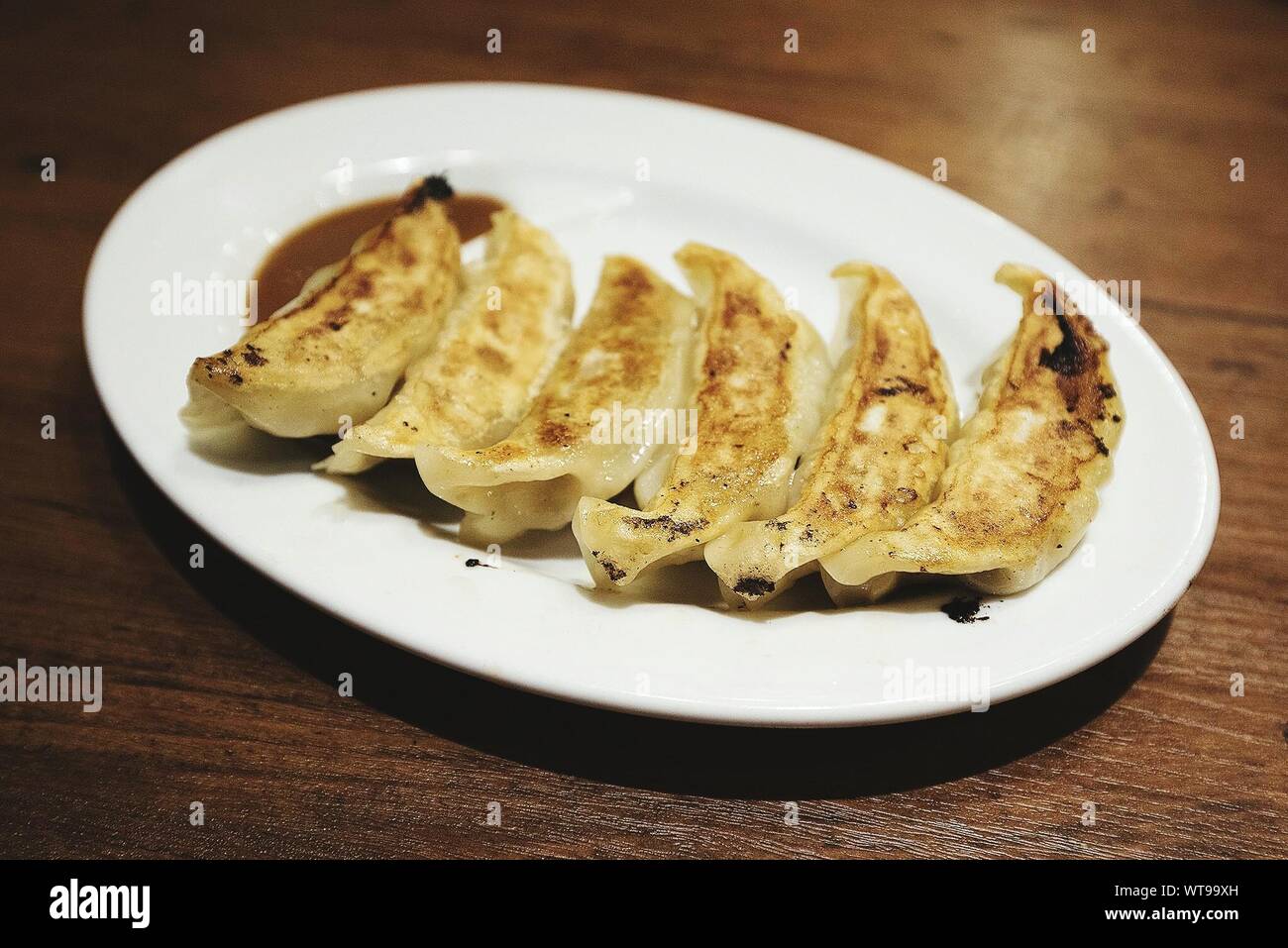 Close-up Of Fresh Crunchy Jiaozis In Plate On Table Stock Photo