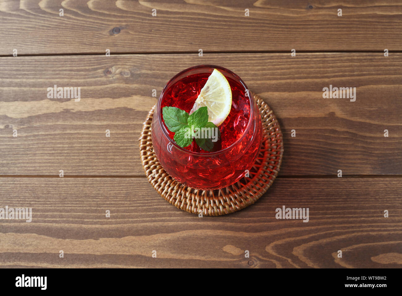 glass of cold tea red drink closeup isolated on table Stock Photo - Alamy