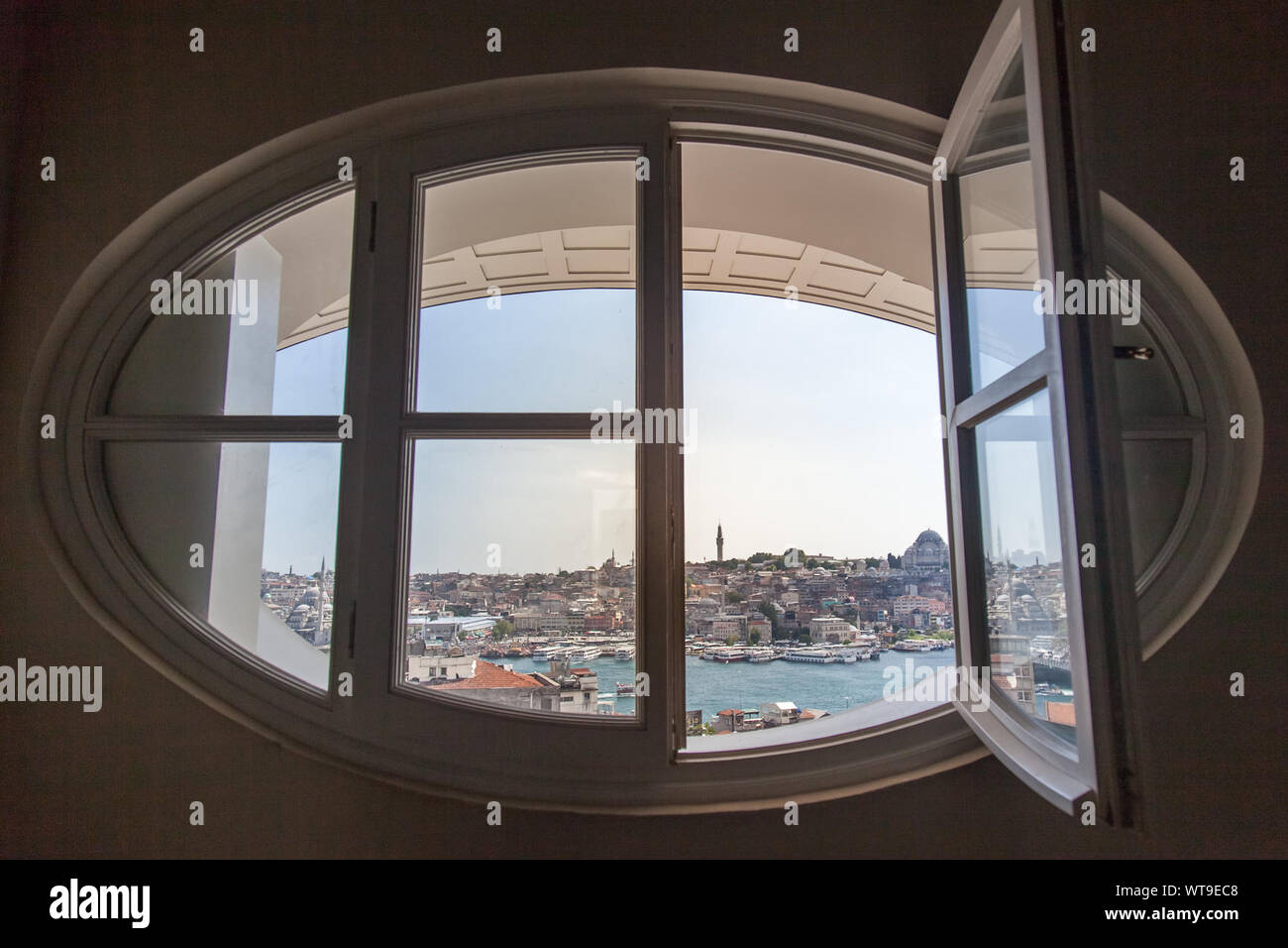 City By Sea Seen Through Ellipse Window Stock Photo