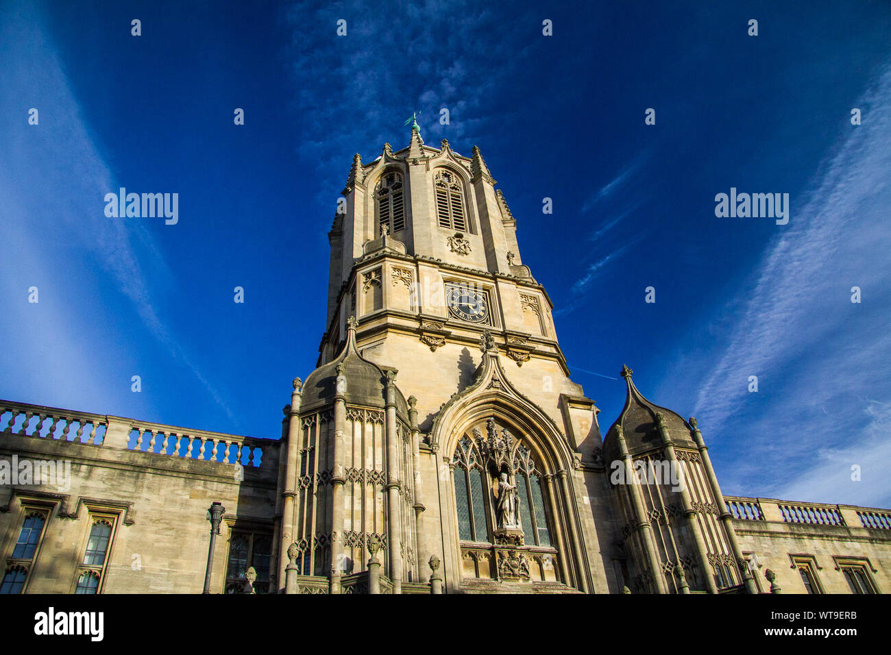Low Angle View Of Tom Tower Against Blue Sky Stock Photo