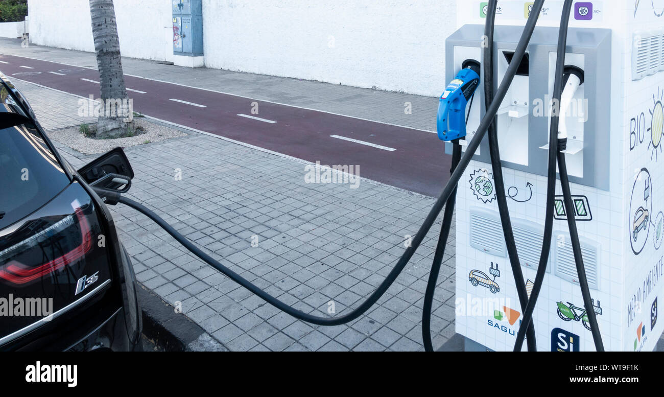 Electric car on charge in city street in Spain Stock Photo Alamy