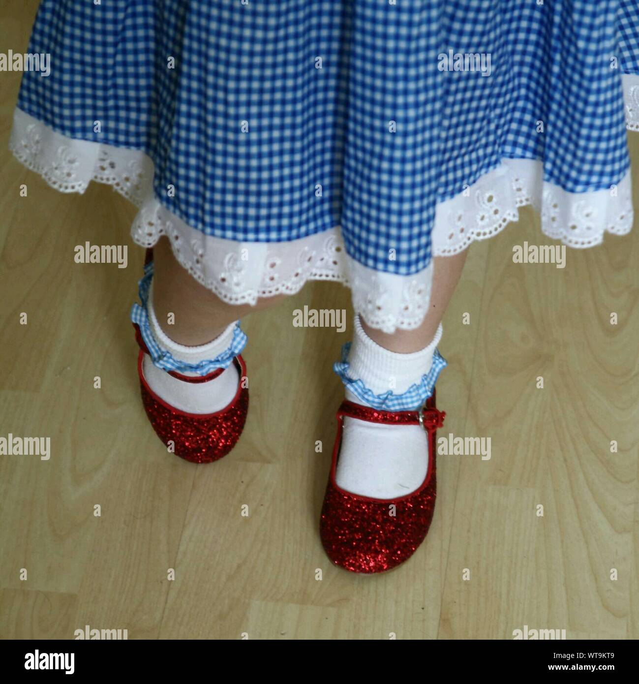 Little girl with red shoes hi-res stock photography and images - Alamy