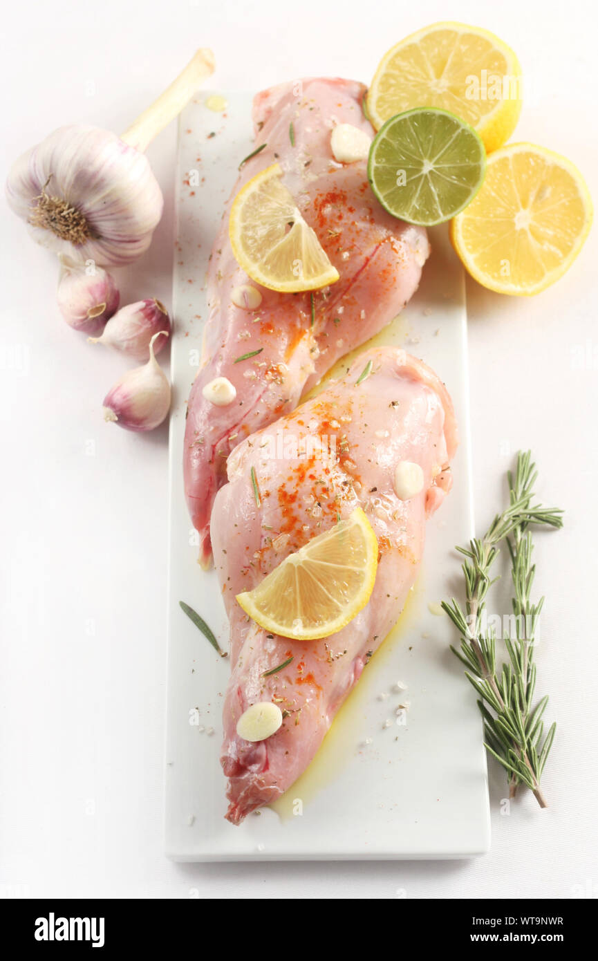 Top View of Two Marinated Rabbit Legs Stock Photo