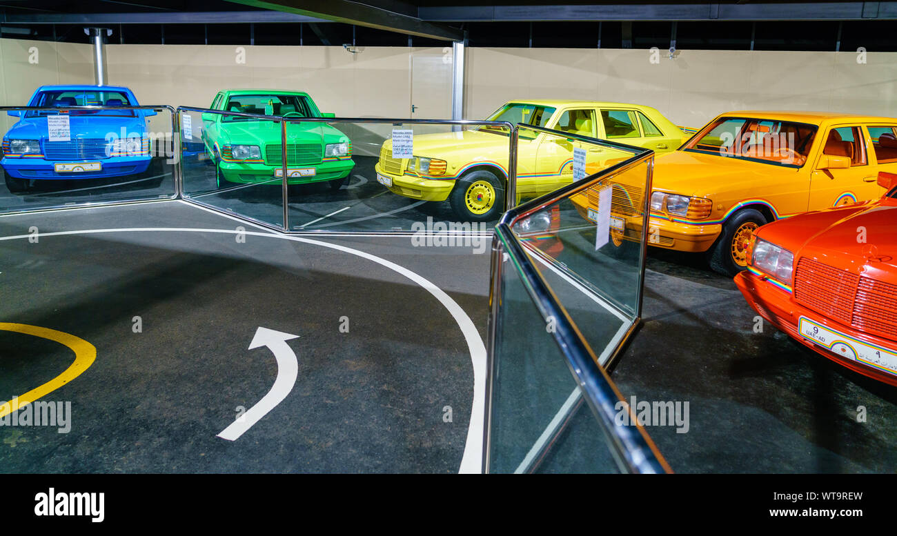 Collection of rainbow-colored Mercedes Benz cars in Emirates National Auto Museum in Abu Dhabi Stock Photo