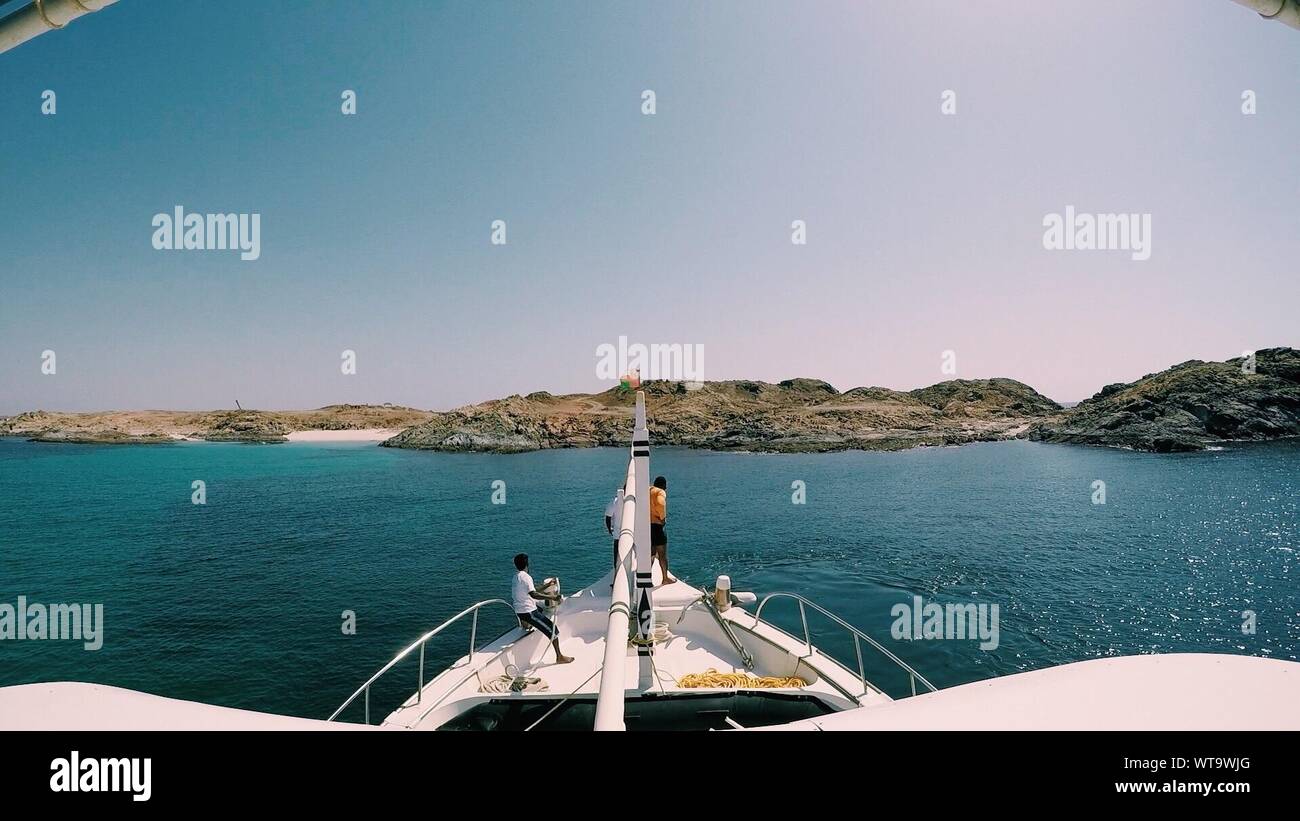 Three Men On Yacht Stock Photo