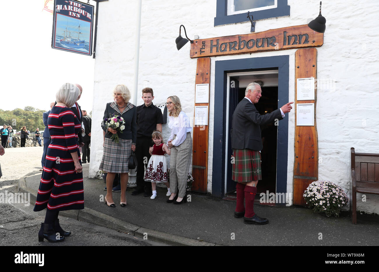 The Prince of Wales and Duchess of Cornwall, known as the Duke and Duchess of Rothesay when in Scotland, pay a visit to the Harbour Inn during a visit to the coastal village of Garlieston, Wigtownshire, where the port played an important role in D-Day preparations in 1944, in the testing of the Mulberry Harbours. PA Photo. Picture date: Wednesday September 11, 2019. See PA story ROYAL Charles. Photo credit should read: Andrew Milligan/PA Wire Stock Photo