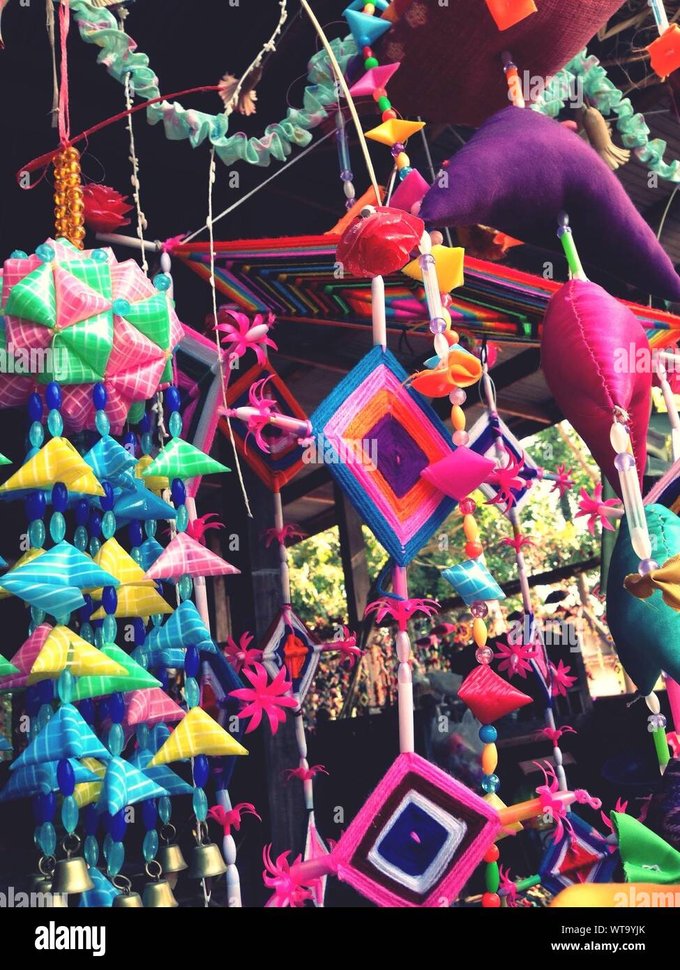 Handcraft Decorations Hanging At Market Stall For Sale Stock Photo
