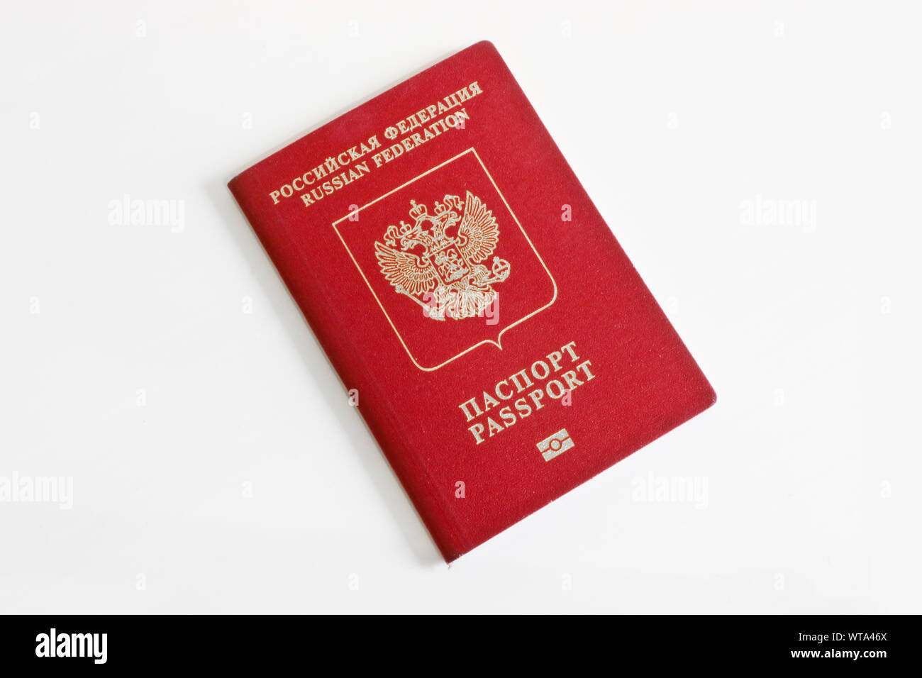 Russian foreign passport on a light gray background. Dark red passport