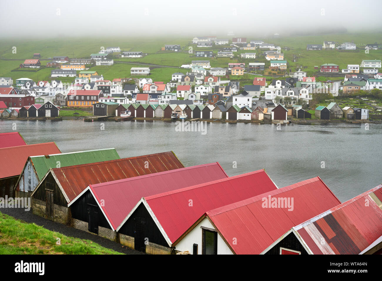 Colorful rooftops on shore of river on Faroe Islands Stock Photo