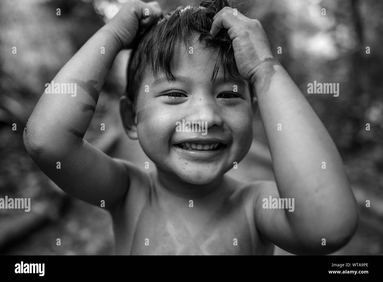 A friendly and happy indigenous boy from the Brazilian Amazon Stock Photo
