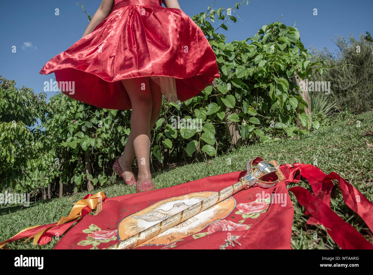 Girl in red dress dancing during revelry of kings Stock Photo - Alamy