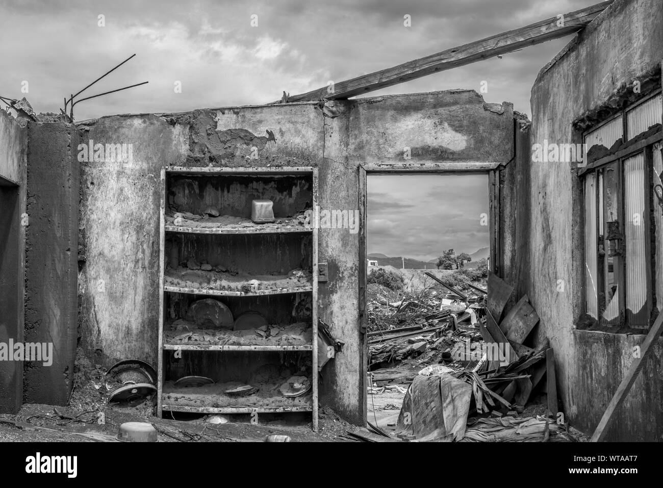 House destroyed after a mining waste disaster Stock Photo