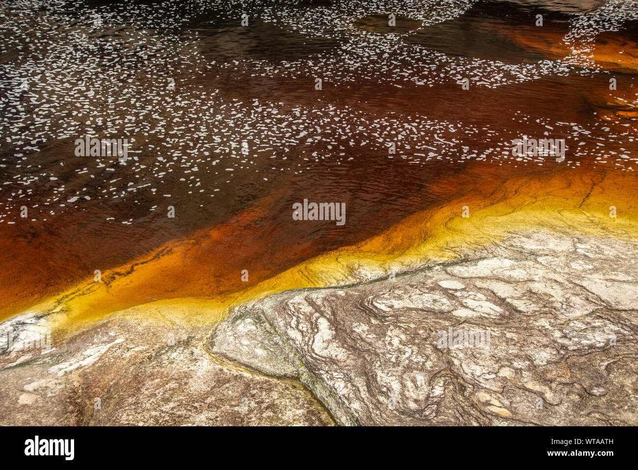 Orange water river in Ibitipoca State Park Stock Photo
