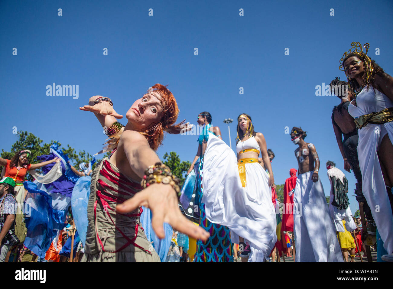 Orquestra VoadoraÂ´s  members with colorful costumes and stilts Stock Photo