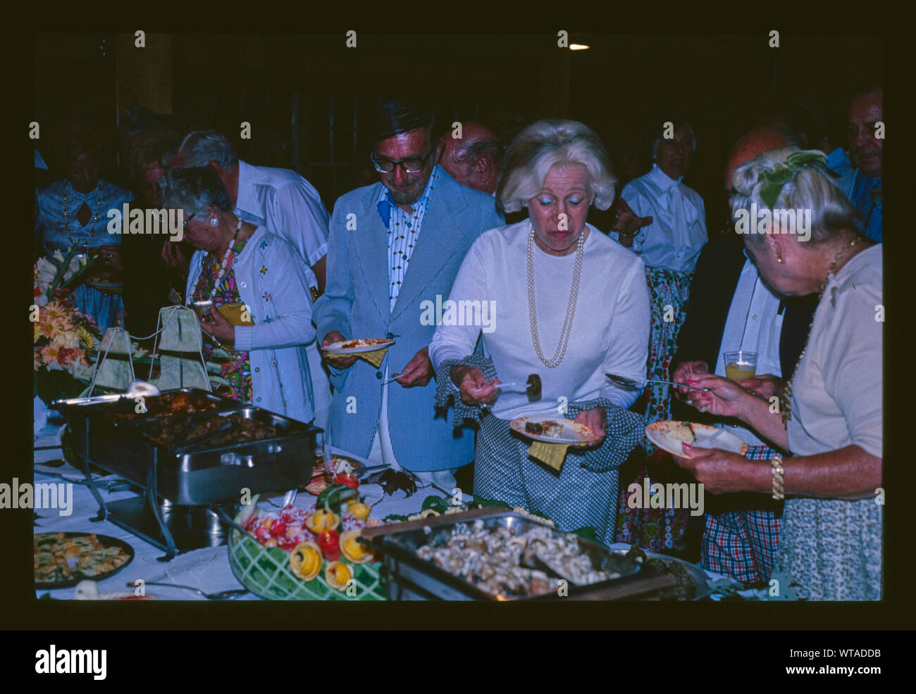 Menges party, guests attack food, 9/3/77, Livingston Manor, New York