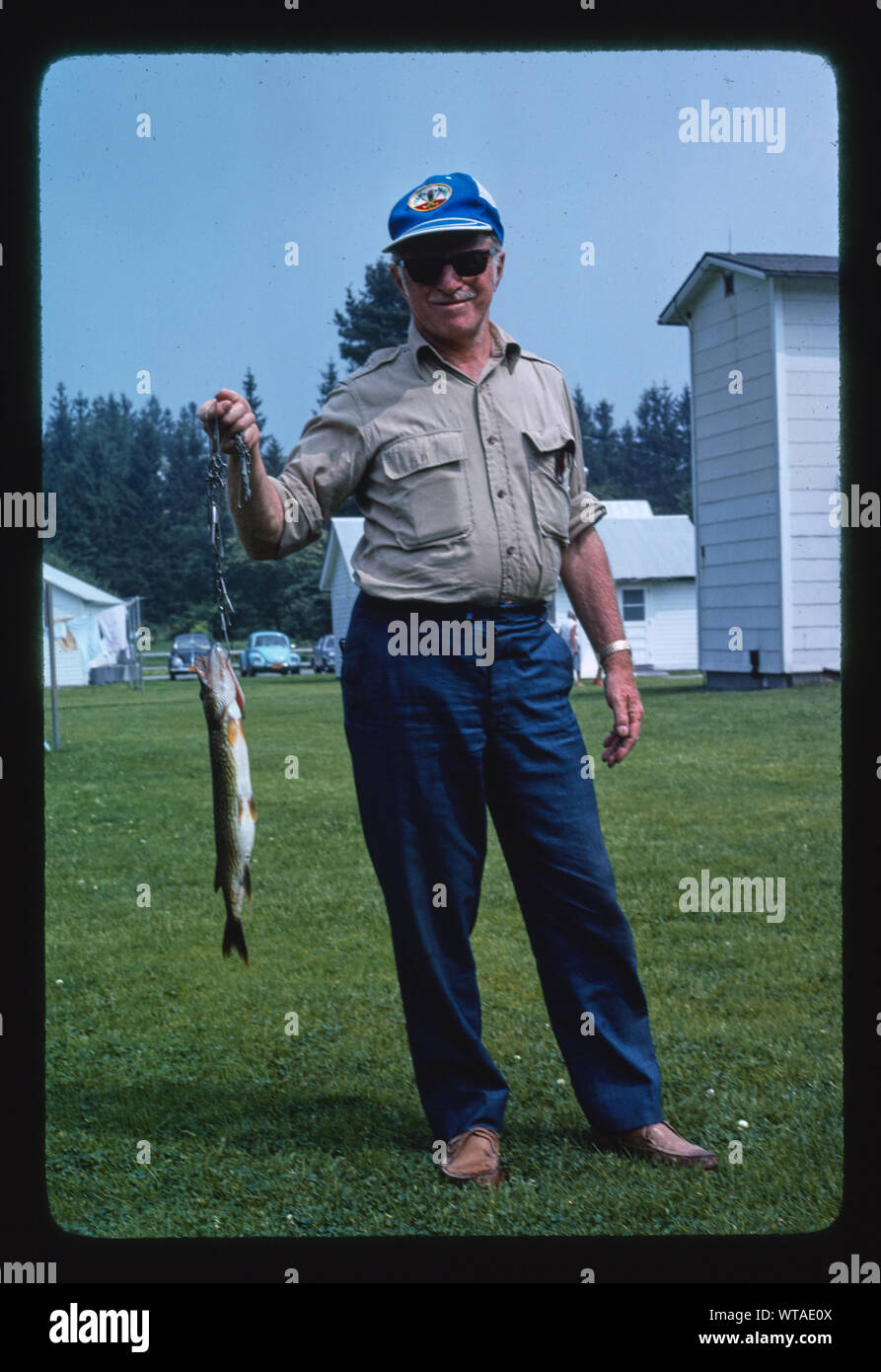 Menges, man with fish, Livingston Manor, New York Stock Photo Alamy