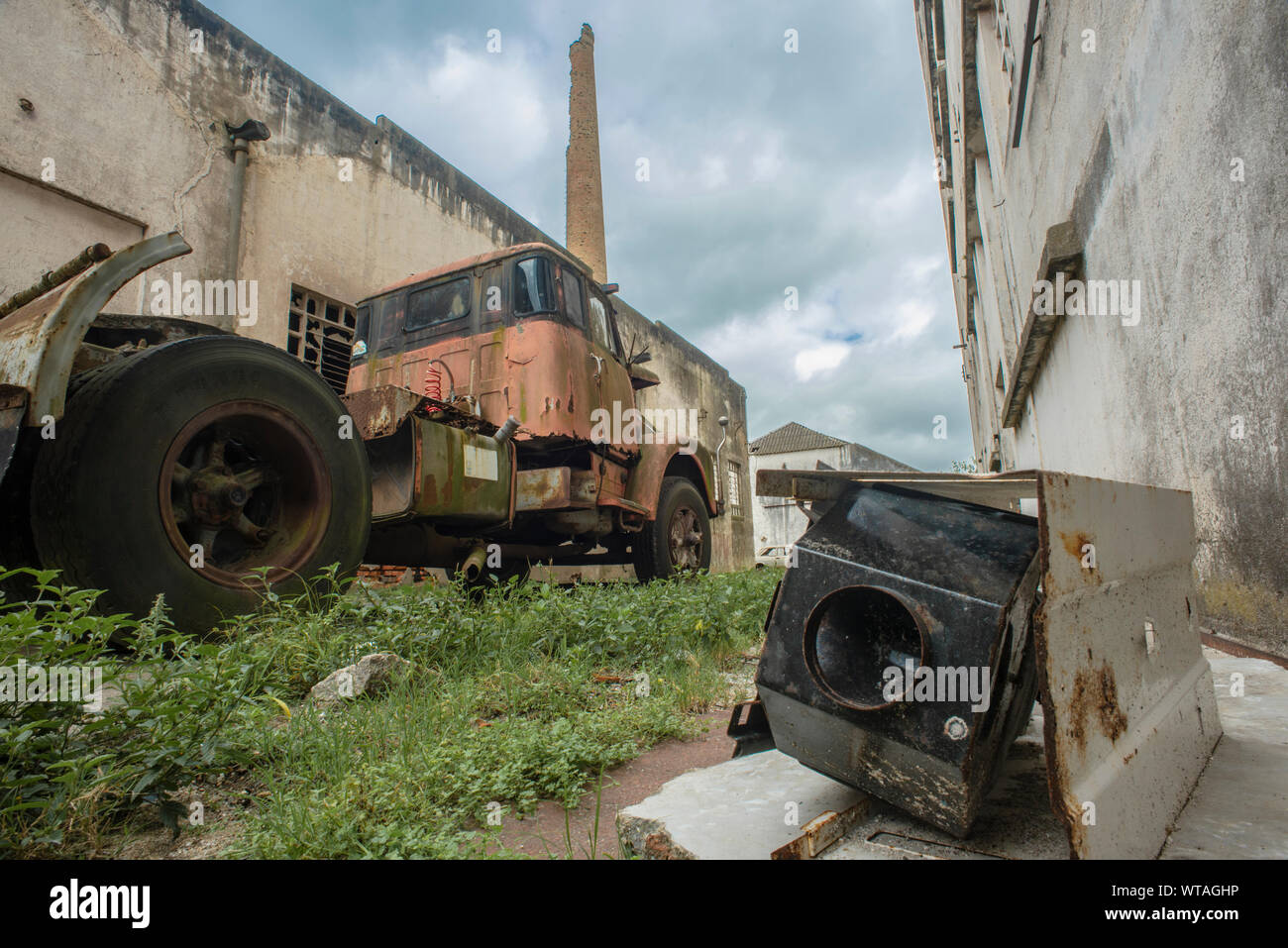 Old truck and security camera in abandoned factory Stock Photo