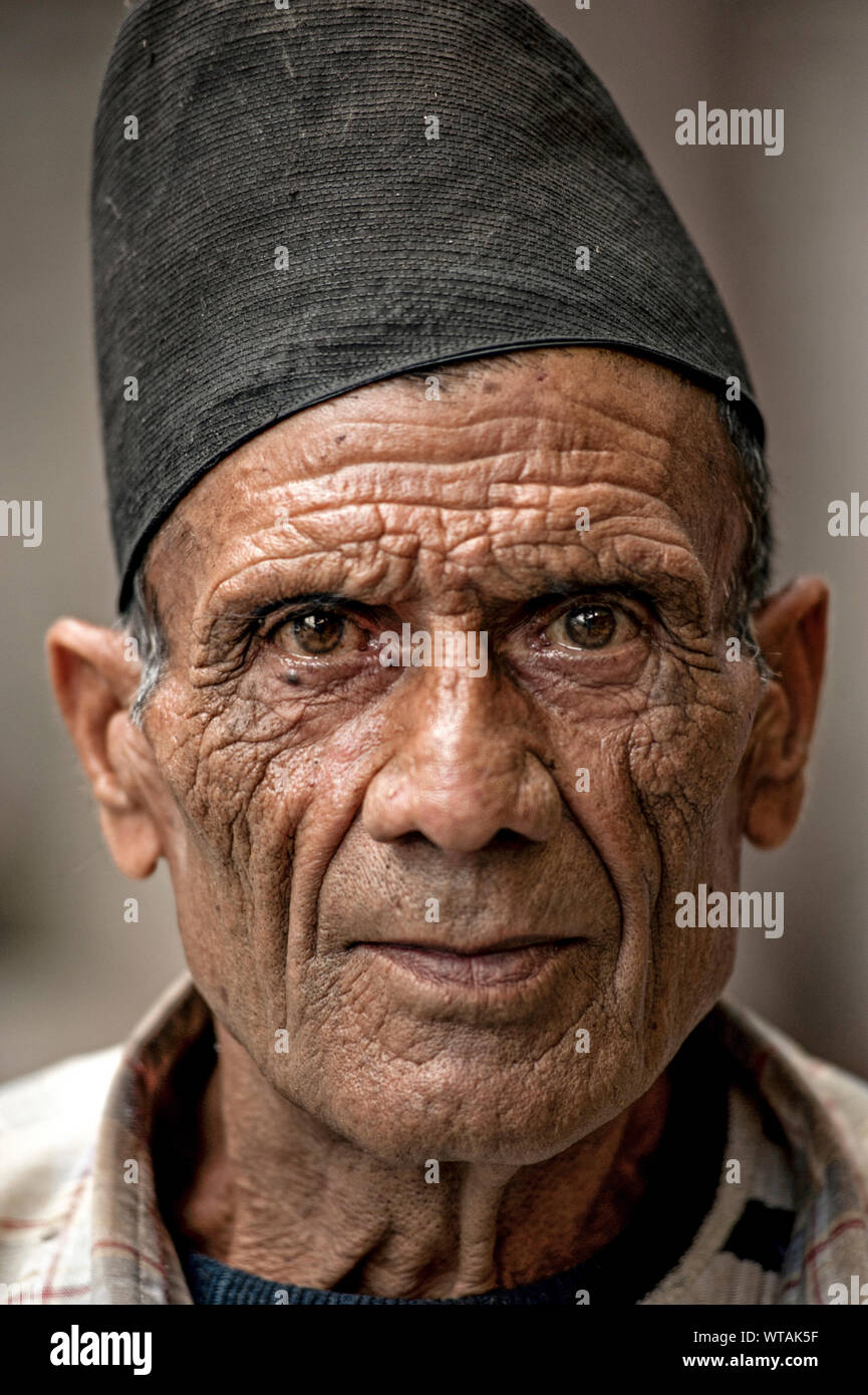 Man wearing a Dhaka topi, a Nepalese traditional cap Stock Photo