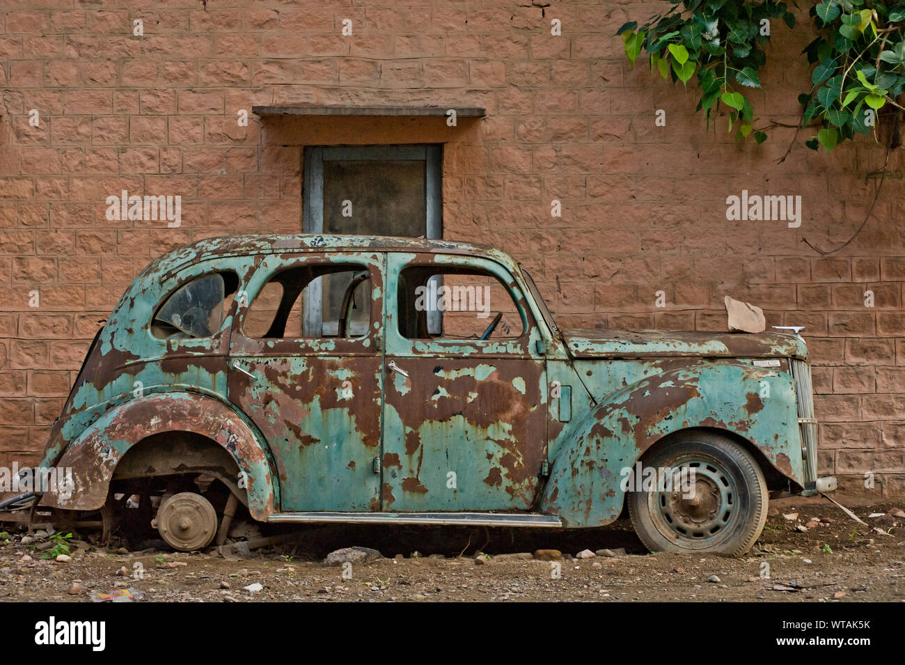Abandoned old car in the streets Stock Photo