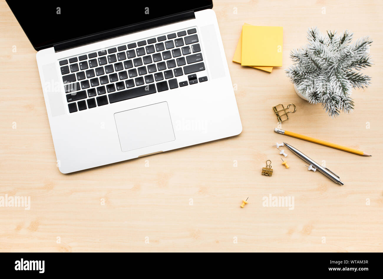Computer laptop with accessories stationary on wood desk table background.Business flat lay mock up object Stock Photo