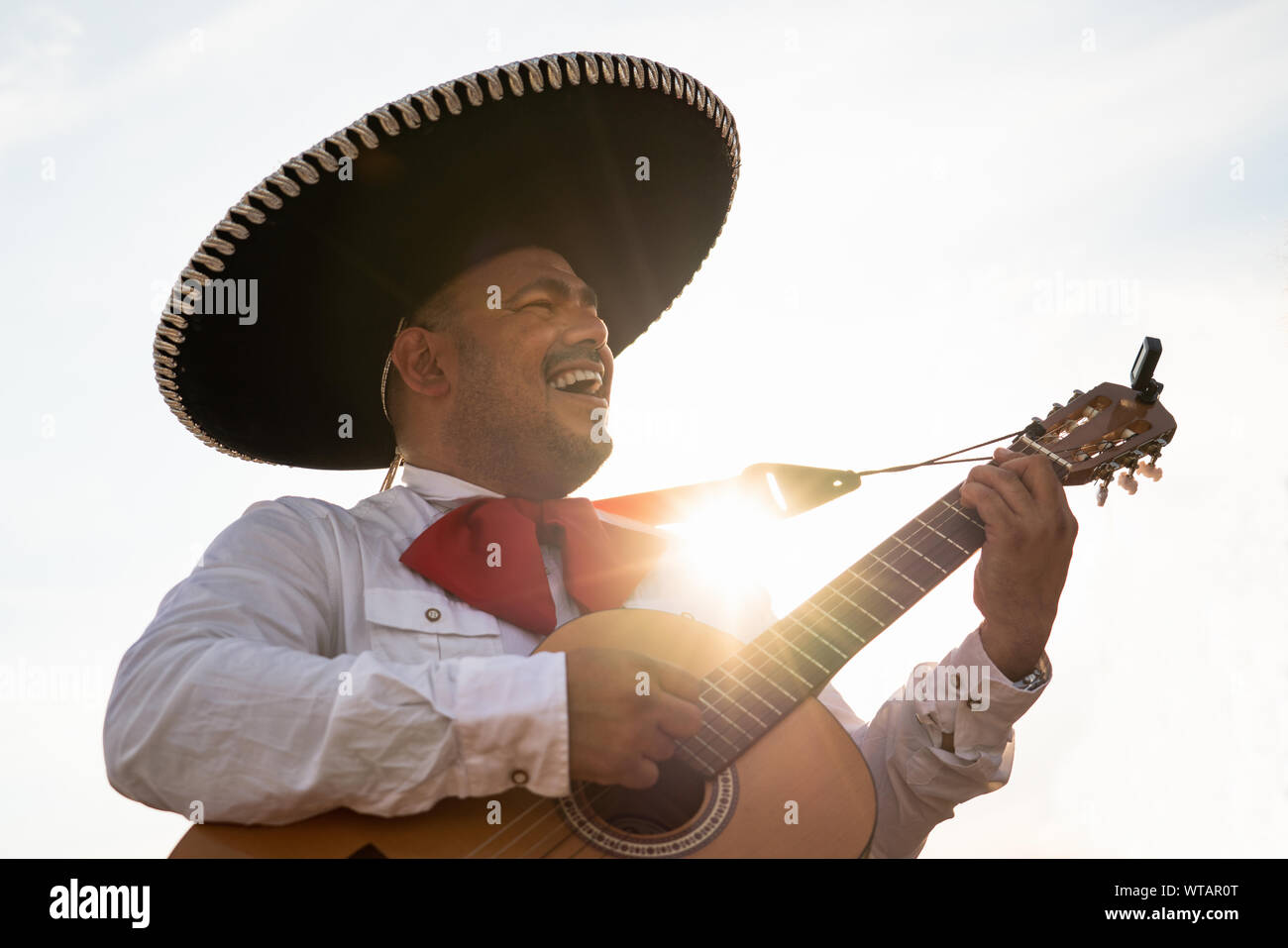 Mexican musicians mariachi playing the guitar Stock Photo